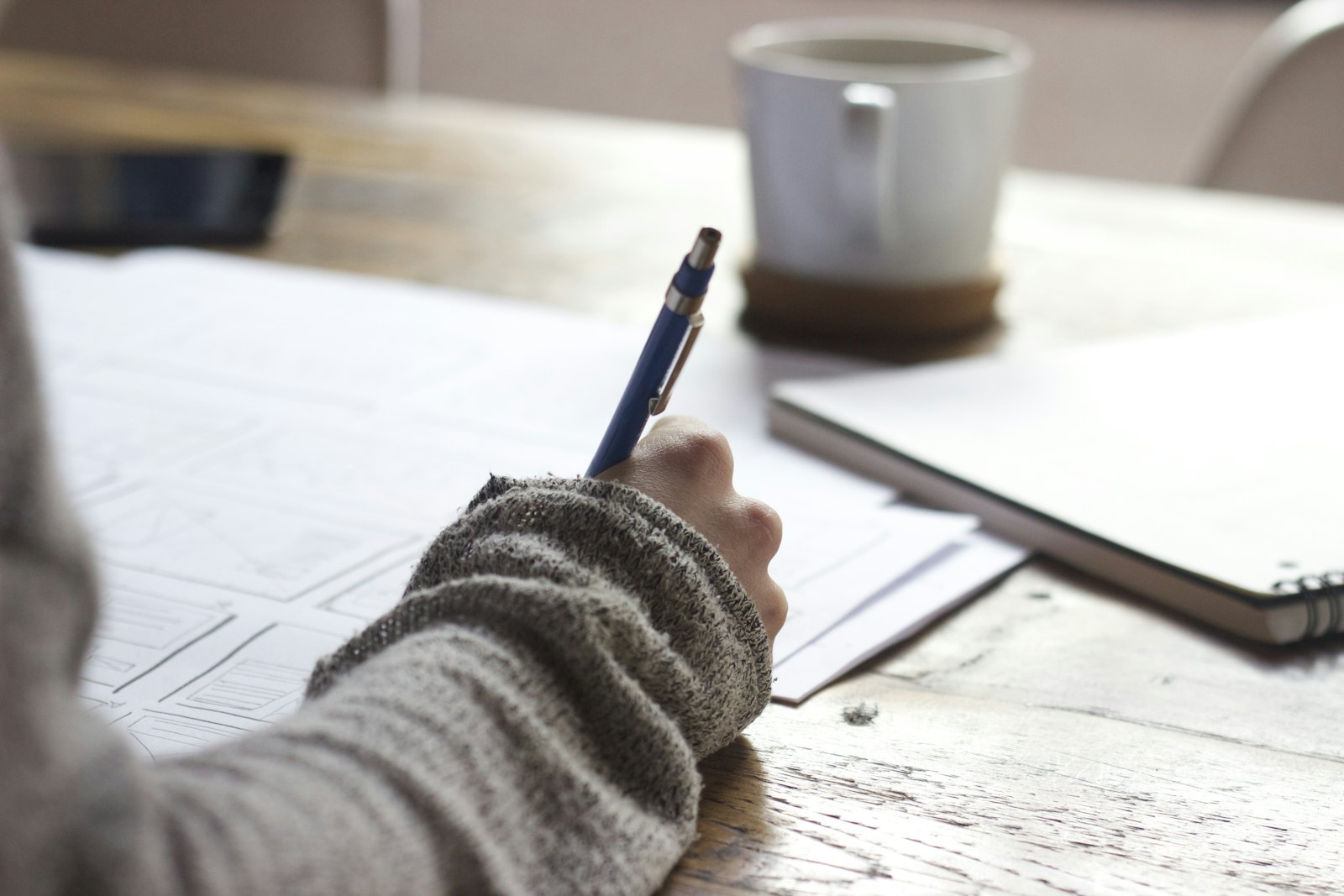 Professional taking notes at a desk